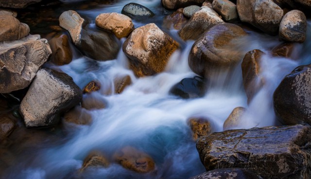 Milky-water-flowing-through-stones-369379-pixahive